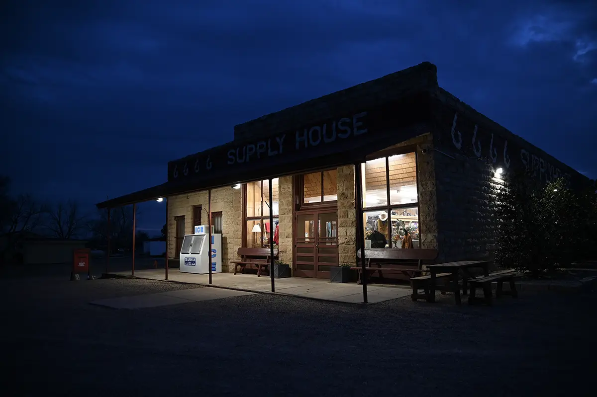 Four Sixes Ranch Supply House at dusk.